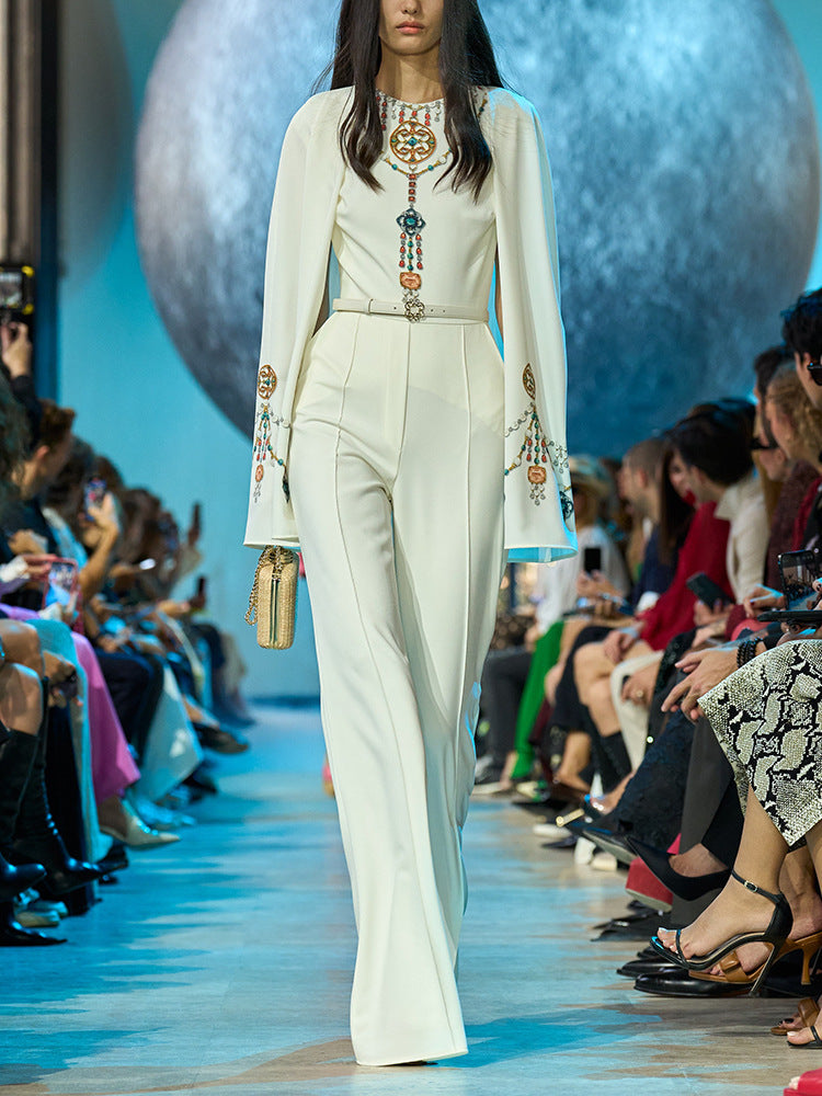 Embellished Ivory Cape Jumpsuit | Elegant White Wide-Leg Jumpsuit with Jewel Appliqué and Long Sleeves MYLINE