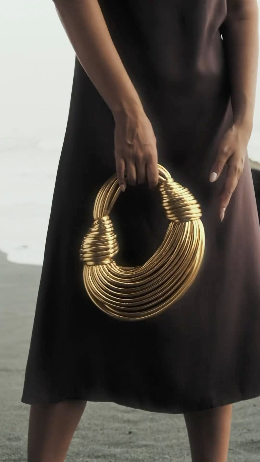 Sculptural Gold Ring Handle Clutch